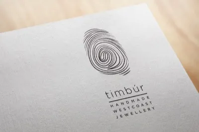 Timbúr handmade jewellery logo embossed on textured linen paper